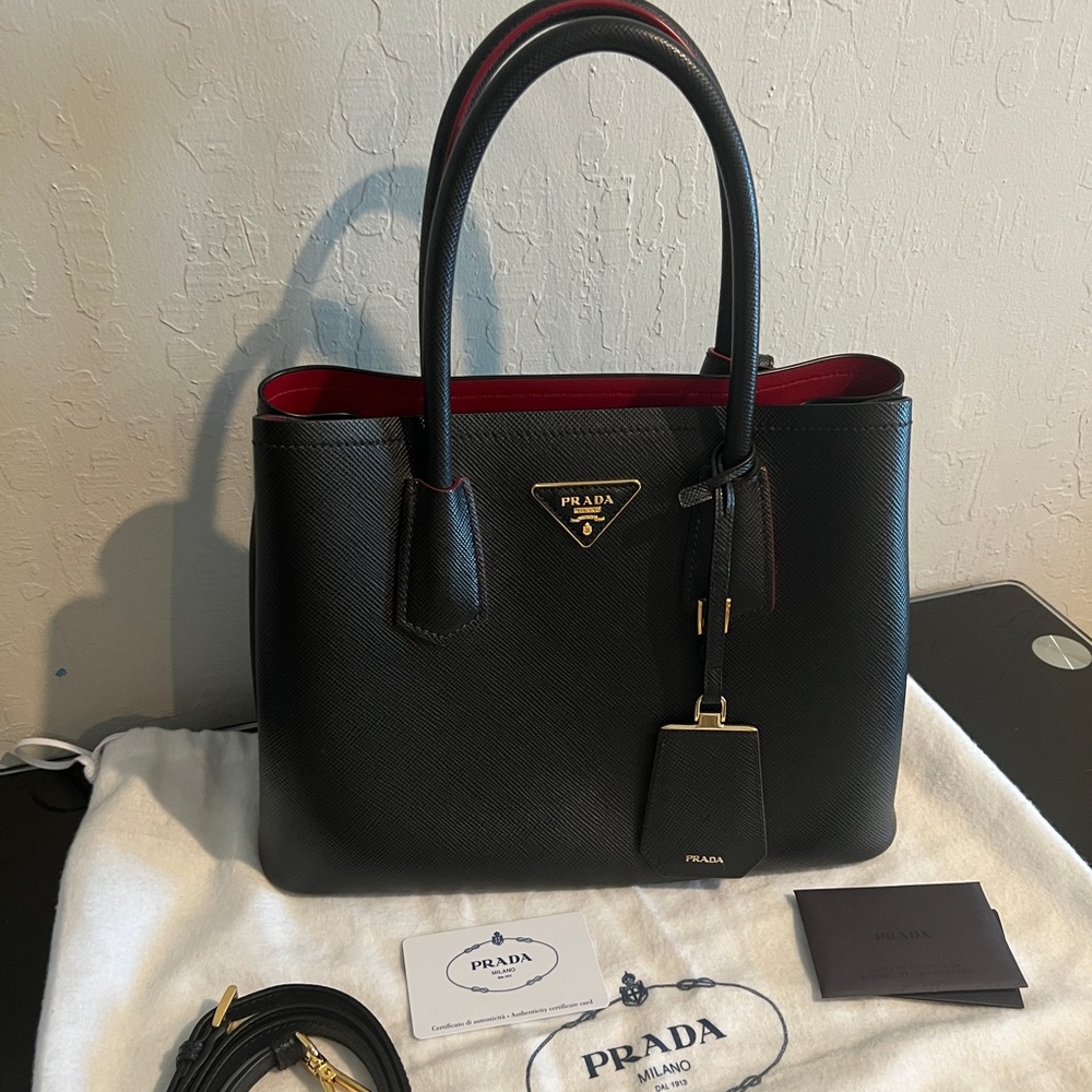 Prada saffiano bag, black color looks like new retail price is 3650 without tax